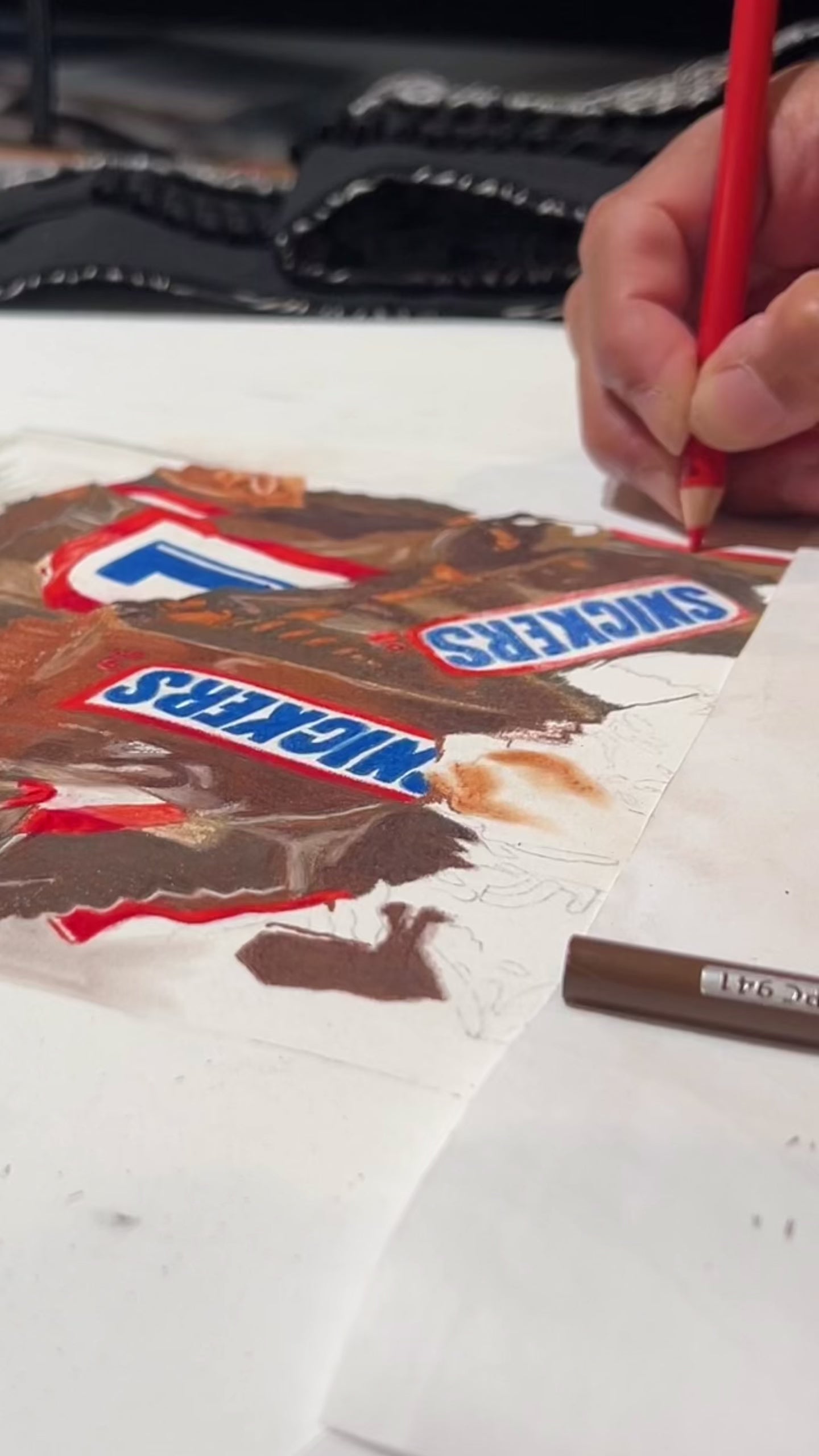 Load video: artist using colored pencils as they draw and color a picture